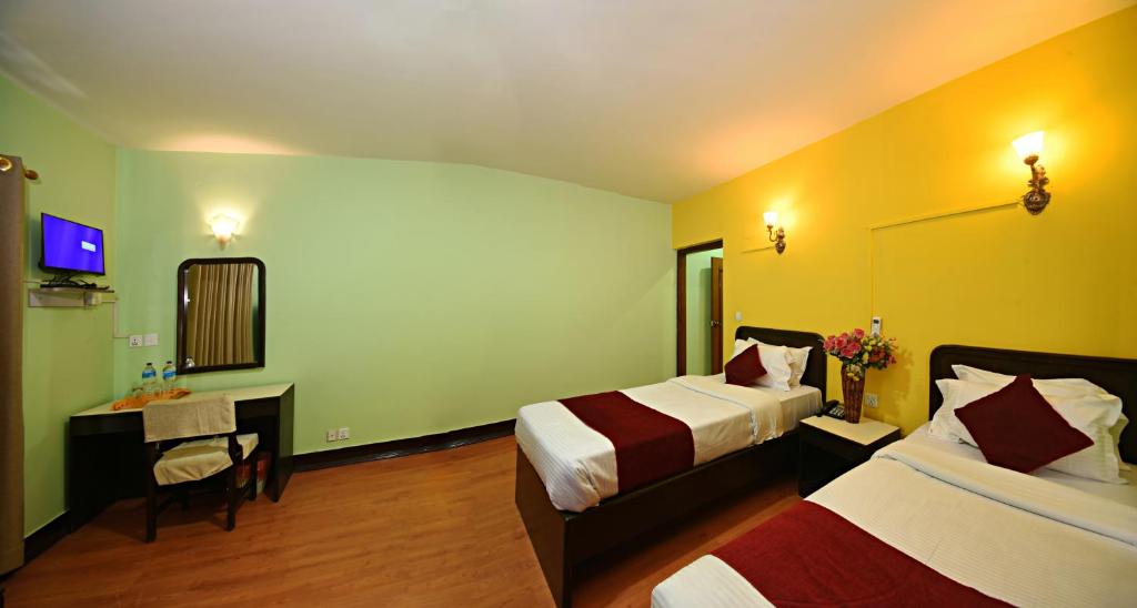 Postel nebo postele na pokoji v ubytování Sacred Boutique Hotel