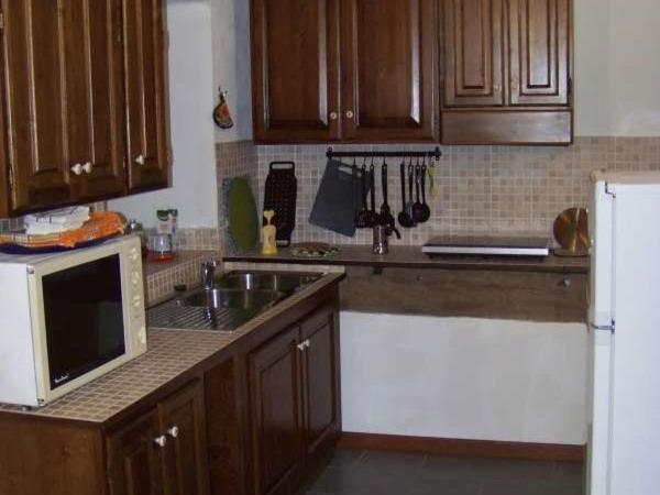 A kitchen or kitchenette at Valdipetrina Appartamenti
