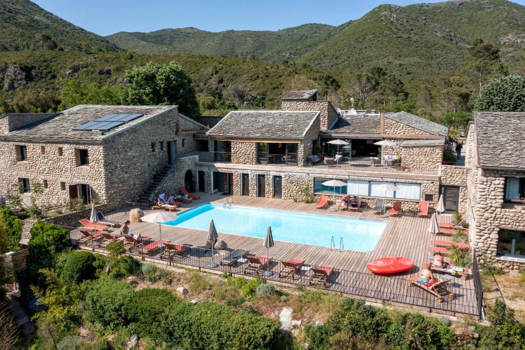 an aerial view of a house with a swimming pool at Hotel Restaurant & Spa E Caselle in Venaco