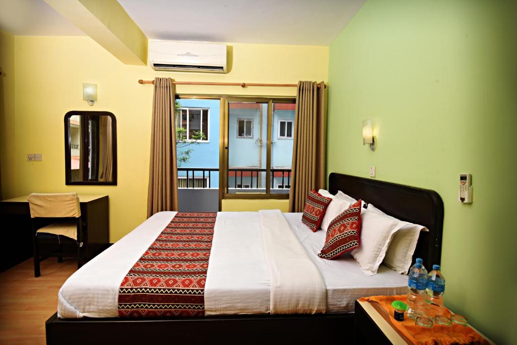 Postel nebo postele na pokoji v ubytování Sacred Boutique Hotel