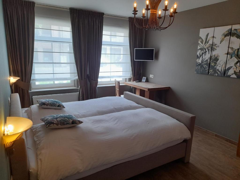 Postel nebo postele na pokoji v ubytování B&B De Floreffe