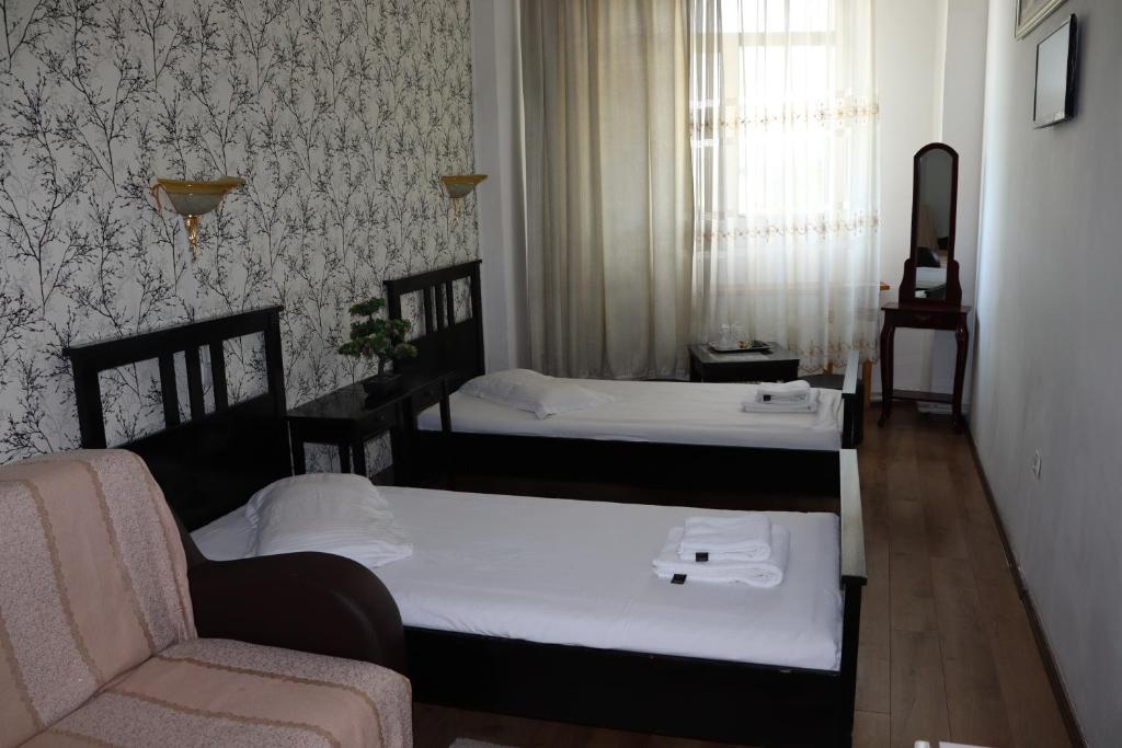 Postel nebo postele na pokoji v ubytování Hotel Funnytime