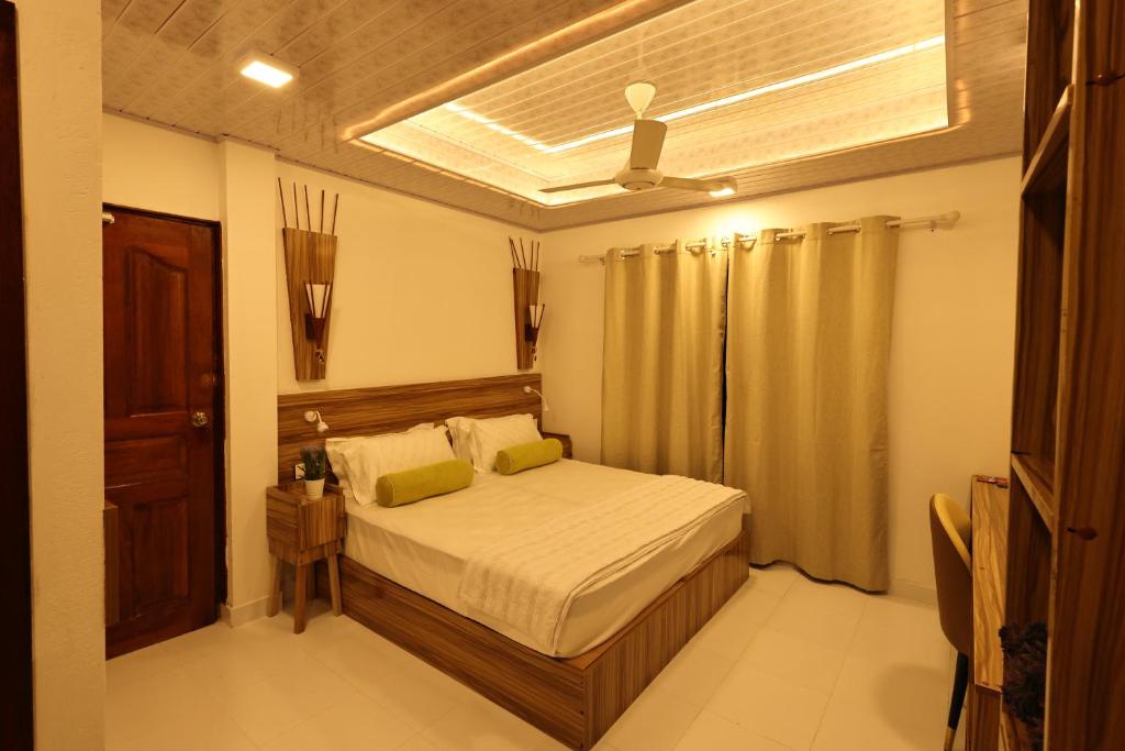 Postel nebo postele na pokoji v ubytování Batuta Maldives Fourson