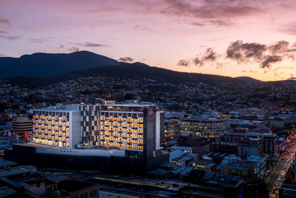 a view of a city at sunset at Crowne Plaza Hobart, an IHG Hotel in Hobart