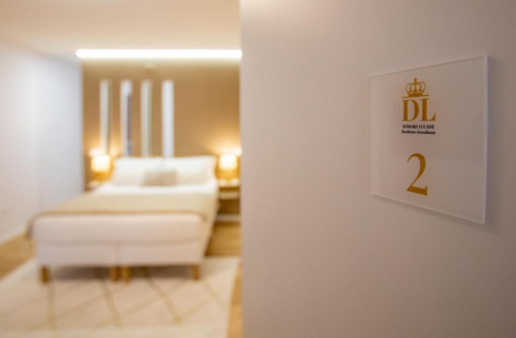 En eller flere senge i et værelse på La Piazzetta Suite