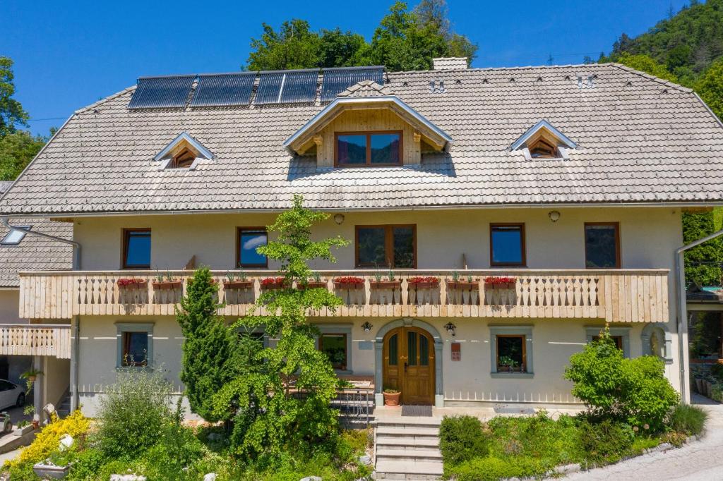 a house with solar panels on the roof at Tourist farm Mulej in Bled