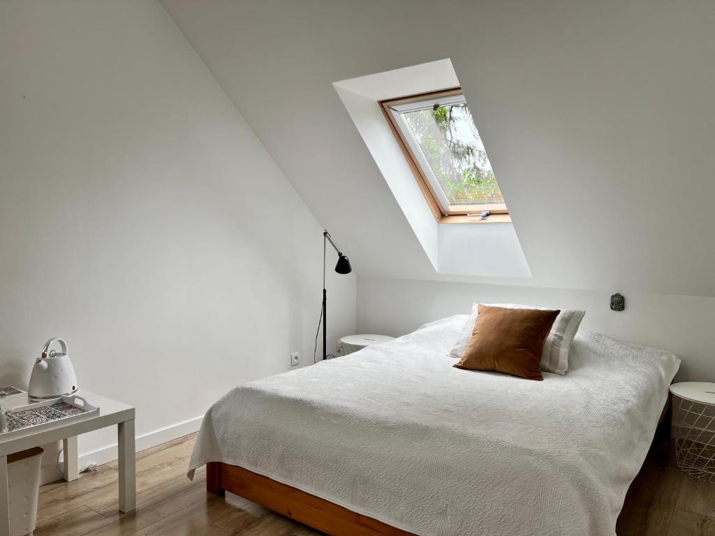 Postel nebo postele na pokoji v ubytování Garden Room