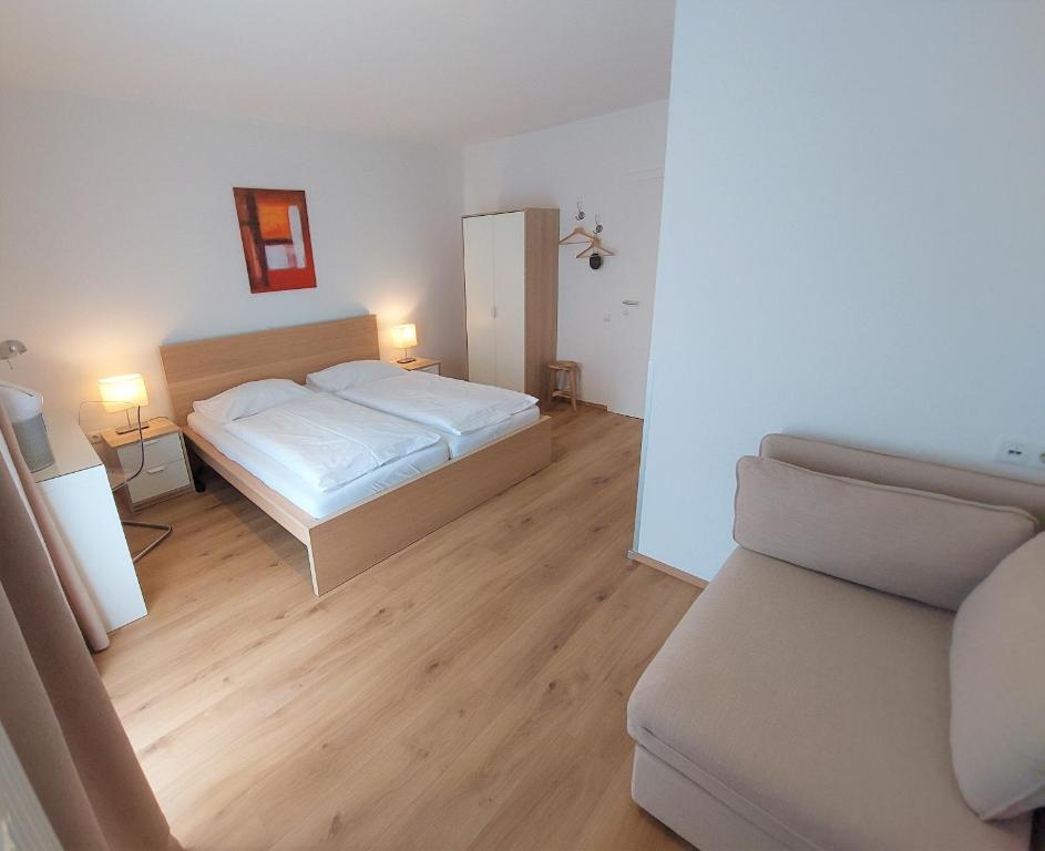 Postel nebo postele na pokoji v ubytování Ewitsch 13 - Hotel Garni