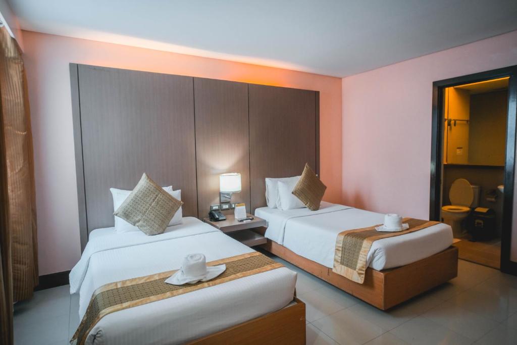 Postel nebo postele na pokoji v ubytování Manila Grand Opera Hotel