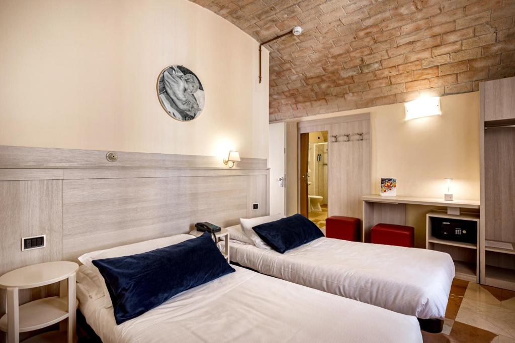 Cama ou camas em um quarto em Hotel Posta Panoramic Assisi