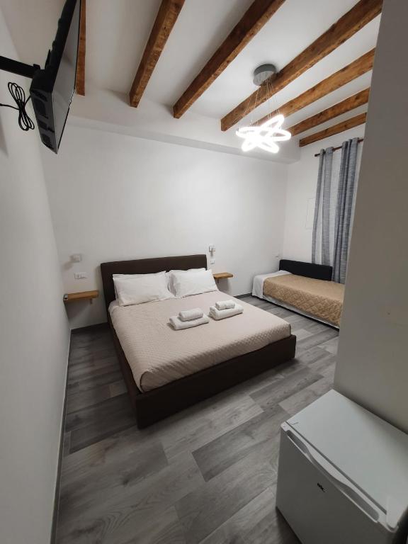 Postel nebo postele na pokoji v ubytování 5 Terre Station Rooms