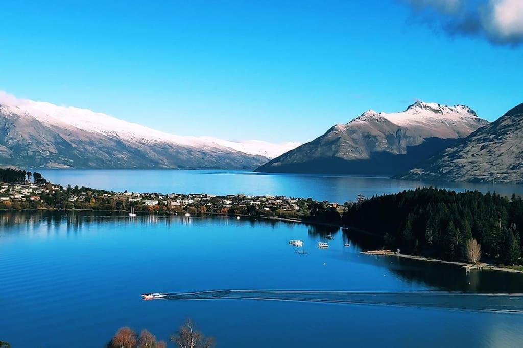 a view of a lake with snow covered mountains at Lovely Apartment- Amazing Lake & Mountain Views in Queenstown