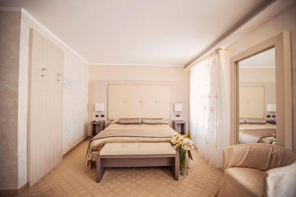 Postel nebo postele na pokoji v ubytování Hotel Trettenero
