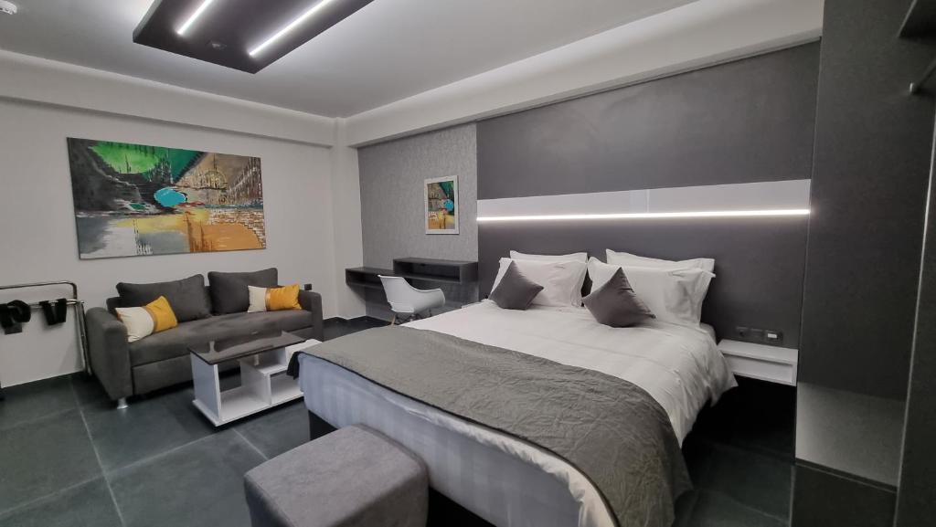 Postel nebo postele na pokoji v ubytování LUXSUITES