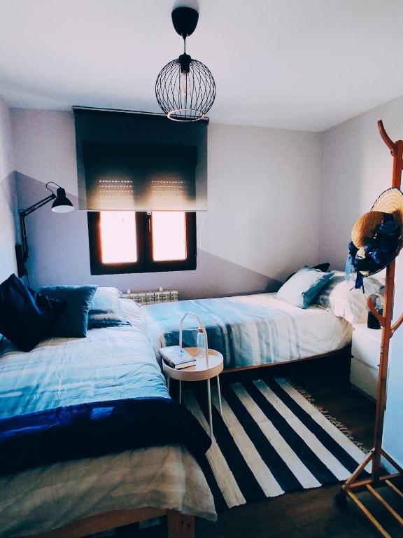 A bed or beds in a room at El Rincón del Alma Mía