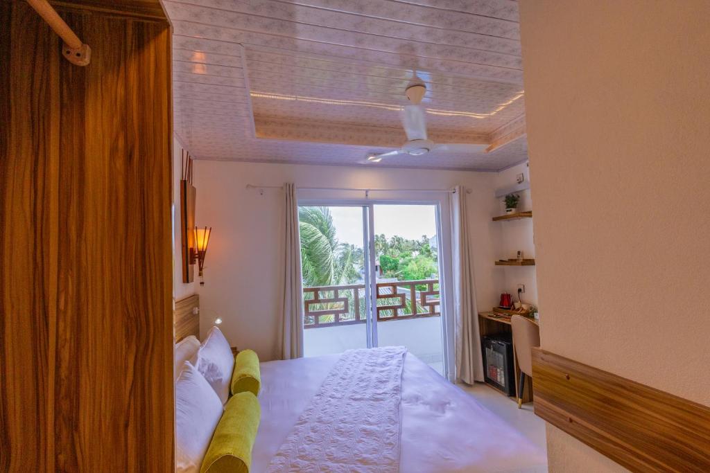 Postel nebo postele na pokoji v ubytování Batuta Maldives Fourson