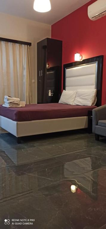 Postel nebo postele na pokoji v ubytování Spiros Rooms