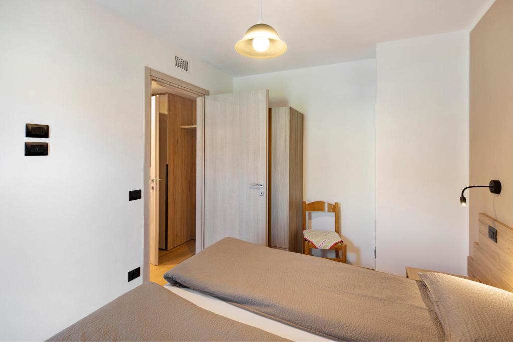 A bed or beds in a room at Appartamento Federia Casa Campacc