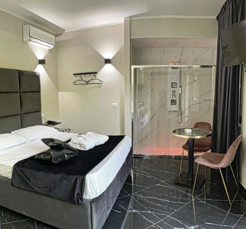 Postel nebo postele na pokoji v ubytování Hotel Trionfal