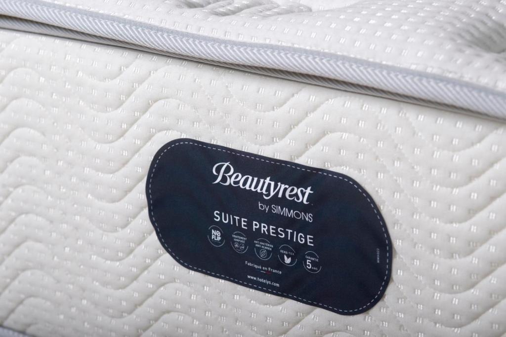 a close up of a mattress with a sign on it at Sivota Deamaris Luxury Boutique Hotel in Syvota
