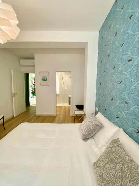 Łóżko lub łóżka w pokoju w obiekcie B&B Il Gabbiano