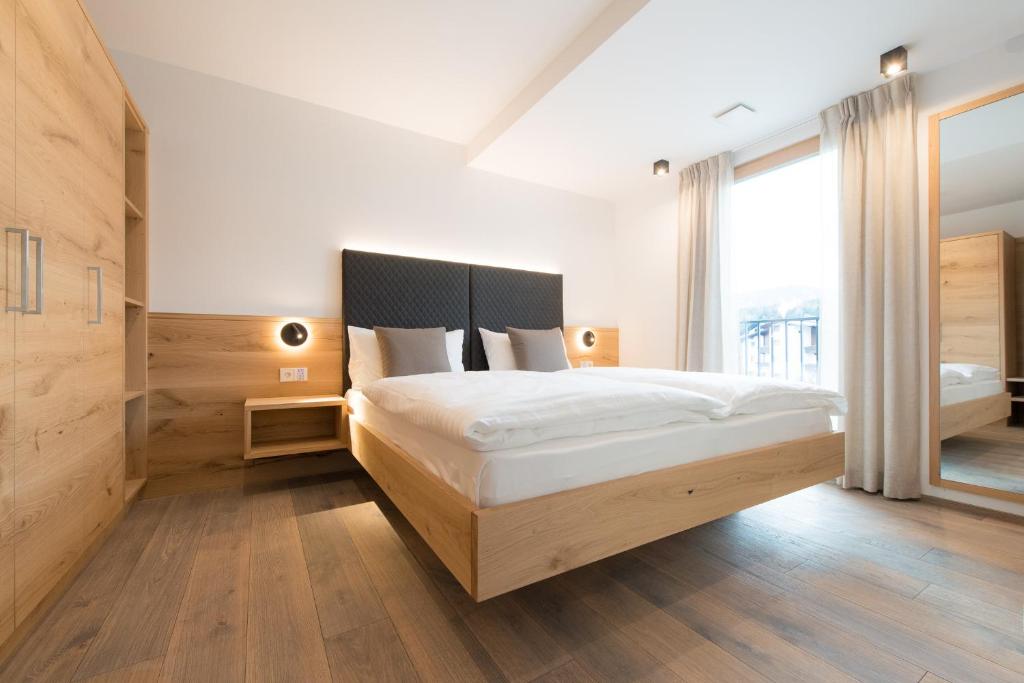 Postel nebo postele na pokoji v ubytování Residence Pitzinger