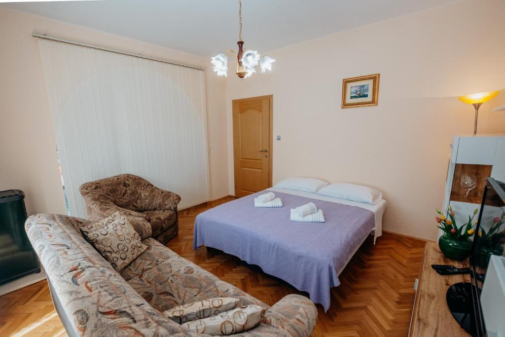 Posteľ alebo postele v izbe v ubytovaní Apartman Neli
