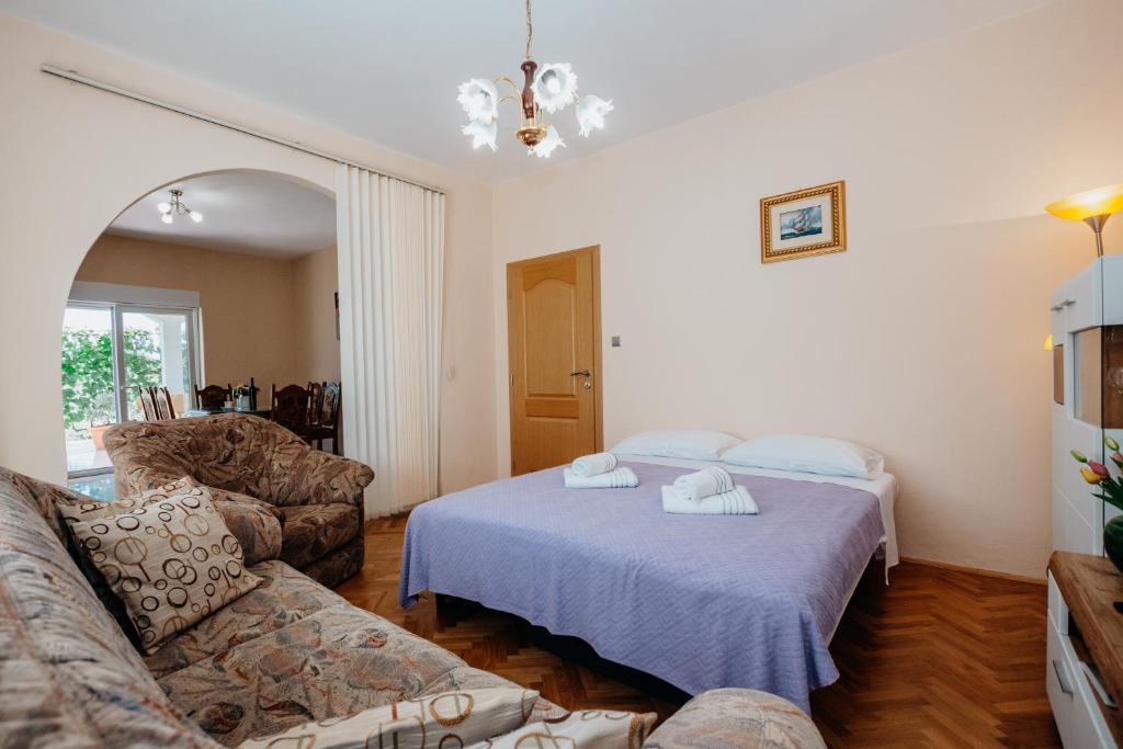 Posteľ alebo postele v izbe v ubytovaní Apartman Neli