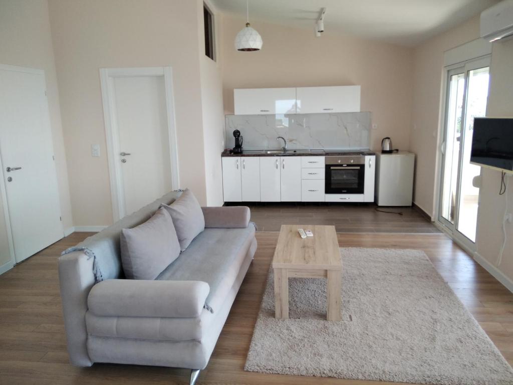 a living room with a couch and a coffee table at Jasmin in Ulcinj