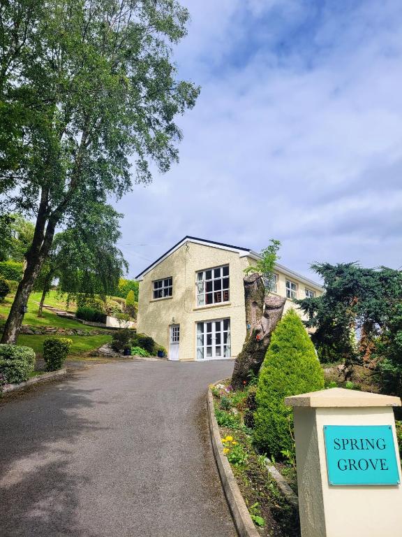 a house with a sign that reads spring grove at Spring Grove Guesthouse in Donegal