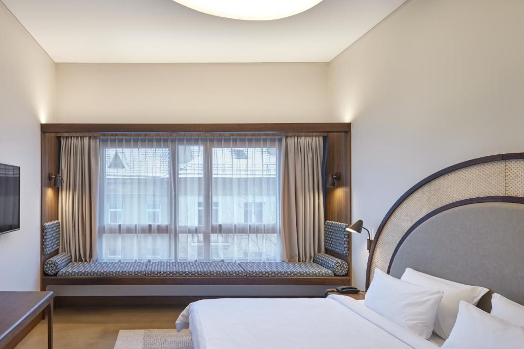 Postel nebo postele na pokoji v ubytování Neringa Hotel