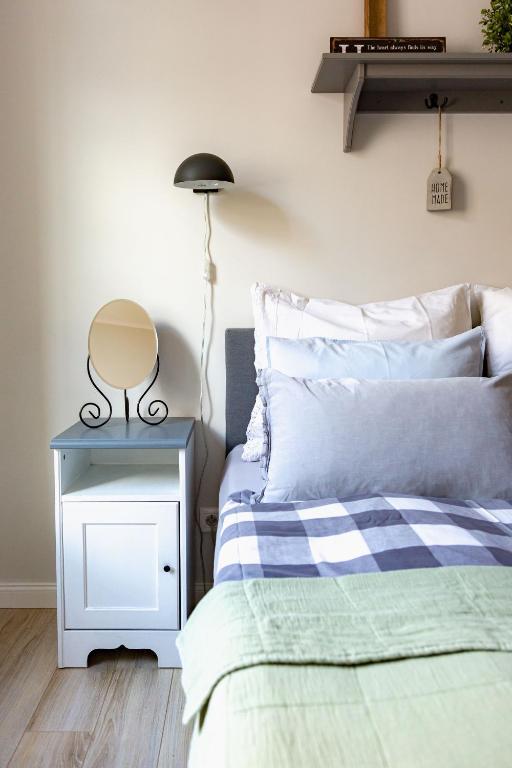 Posteľ alebo postele v izbe v ubytovaní Apartament Wigilijna Starówka