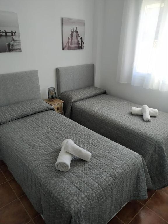 Postel nebo postele na pokoji v ubytování Casa Cristy