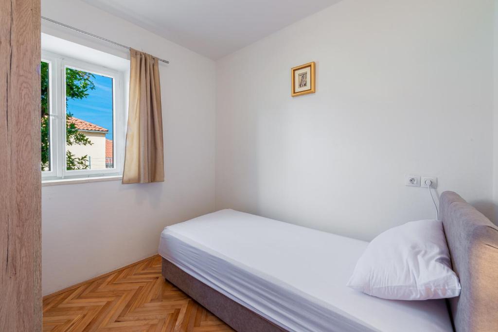 Posteľ alebo postele v izbe v ubytovaní Sea Shell Apartments