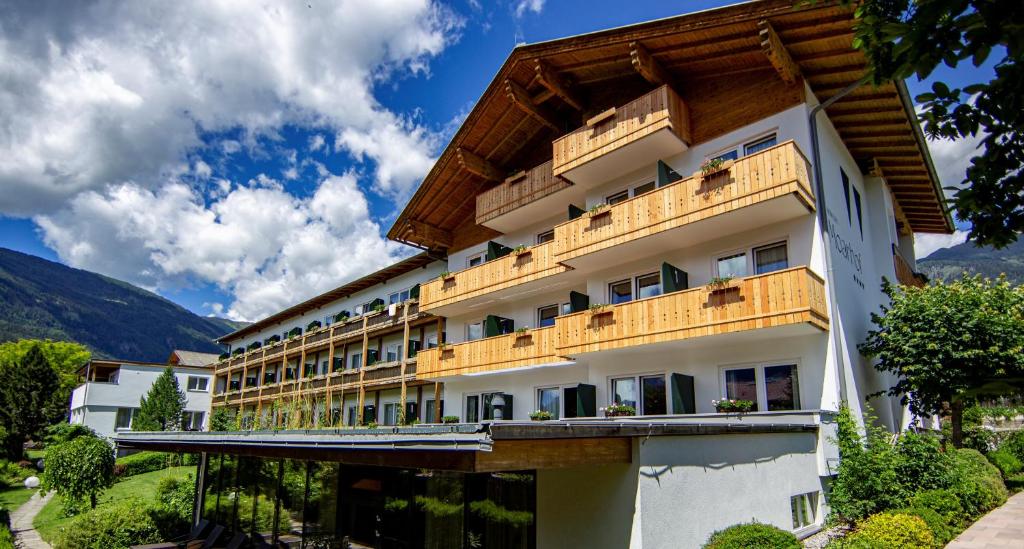 a large building with a view of the ocean at Hotel Moarhof in Lienz