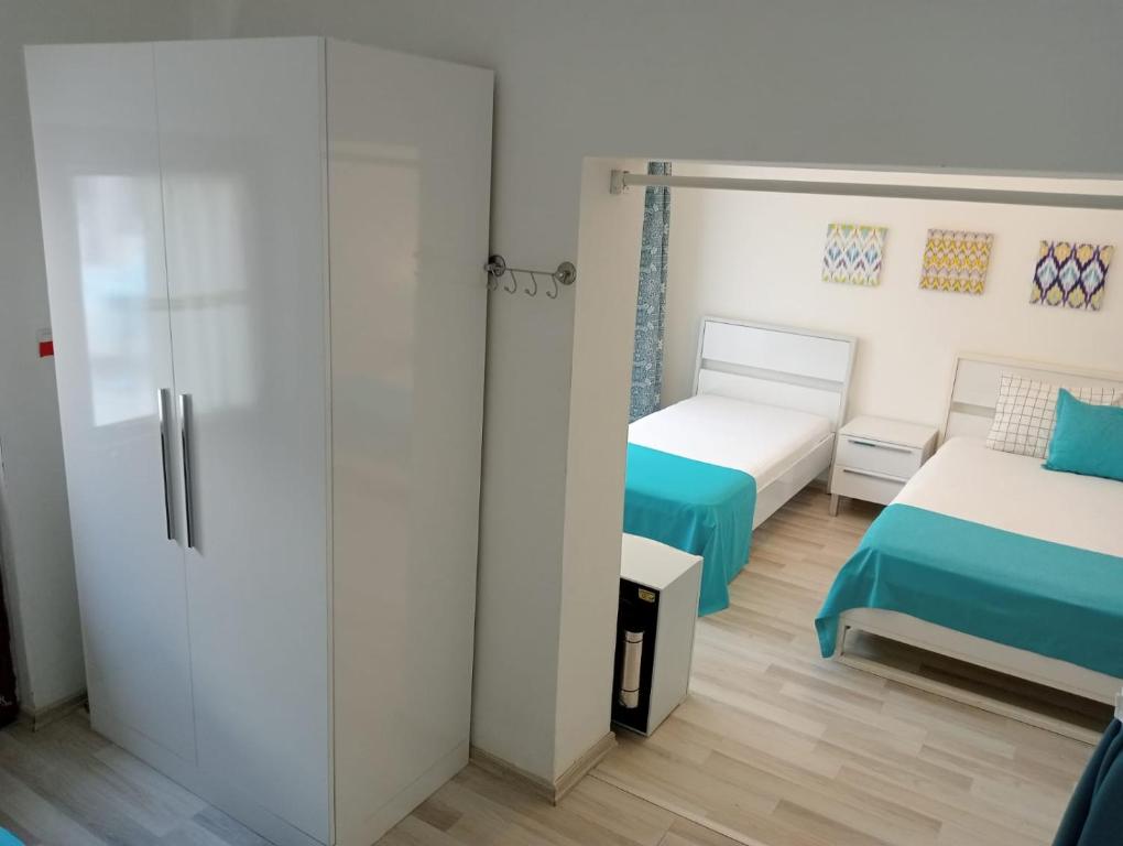 Postel nebo postele na pokoji v ubytování Daffne Otel