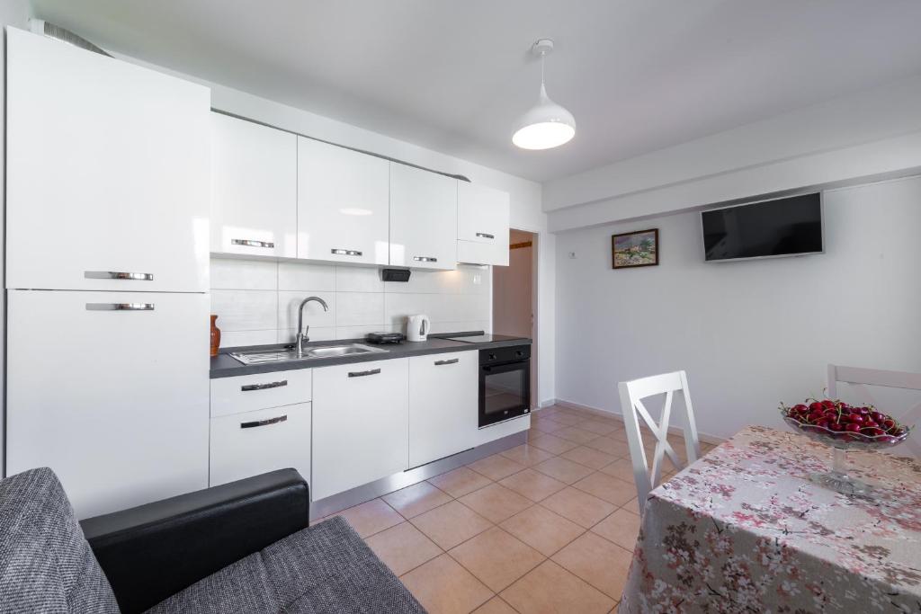 Kuchyňa alebo kuchynka v ubytovaní Sea Shell Apartments