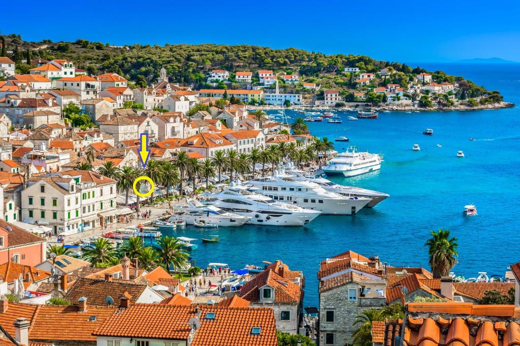 a view of a town with boats in the water at Apartment Rosana - ZF Hvar in Hvar
