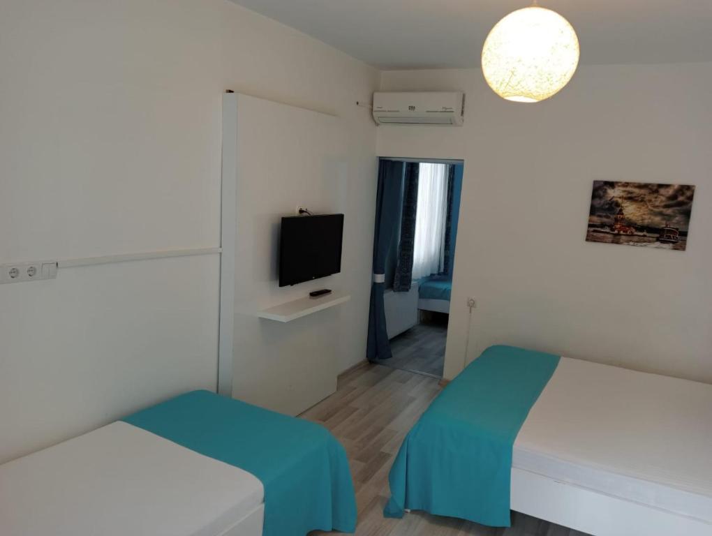 Postel nebo postele na pokoji v ubytování Daffne Otel