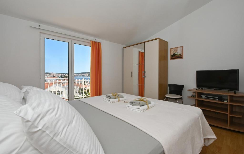 Ένα ή περισσότερα κρεβάτια σε δωμάτιο στο Apartments Ljube