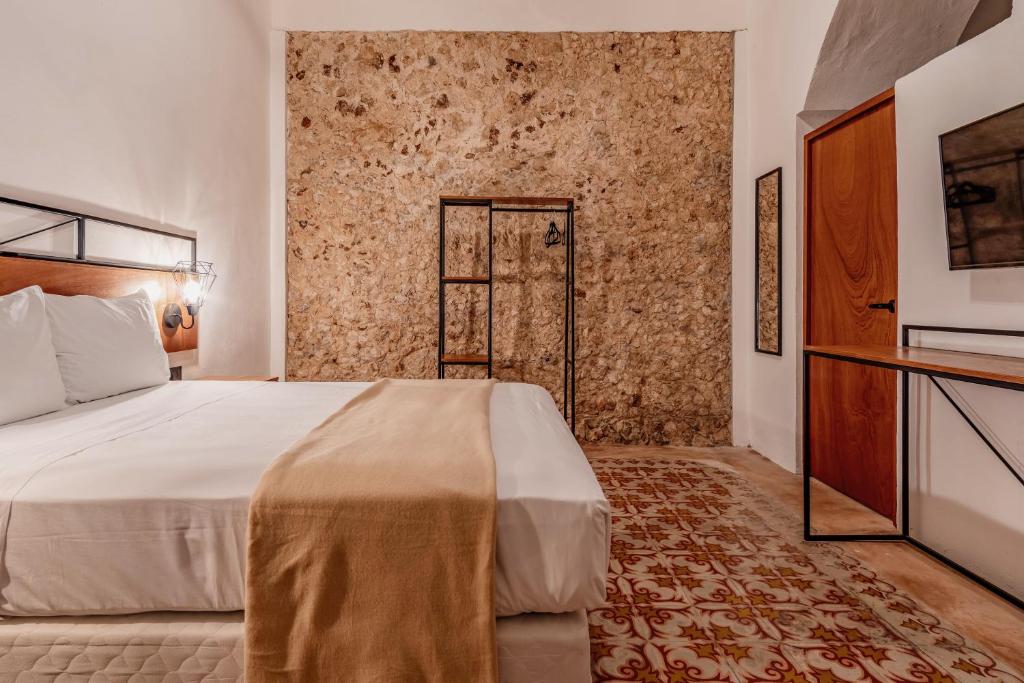 Postel nebo postele na pokoji v ubytování Hotel HO Merida