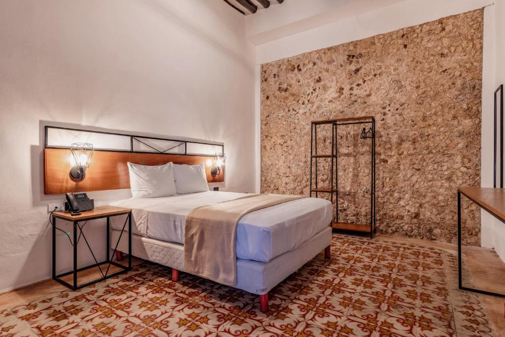 Postel nebo postele na pokoji v ubytování Hotel HO Merida