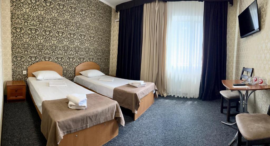 Postel nebo postele na pokoji v ubytování Hotel LaMa 2