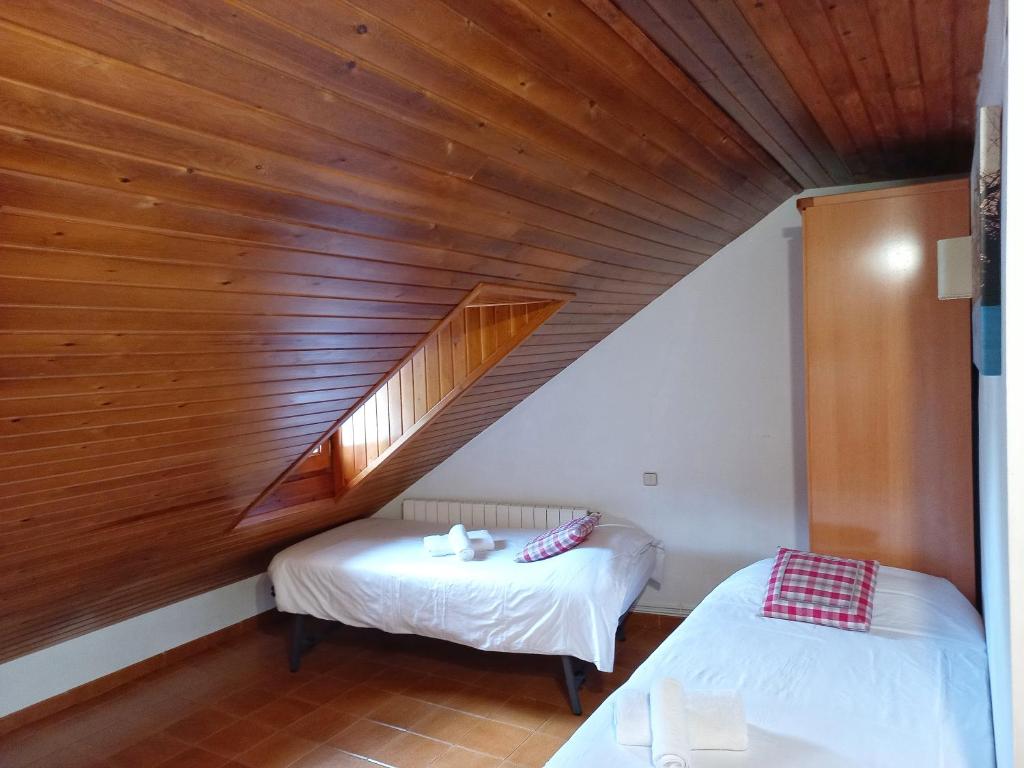 Postel nebo postele na pokoji v ubytování Estudi Casa Xulla