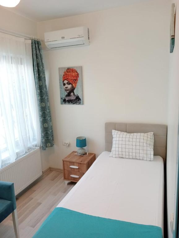 Postel nebo postele na pokoji v ubytování Daffne Otel