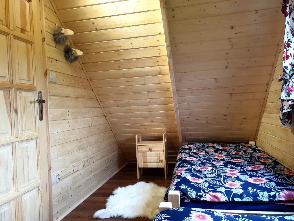 Postel nebo postele na pokoji v ubytování Trzy Szczyty-Turbacz