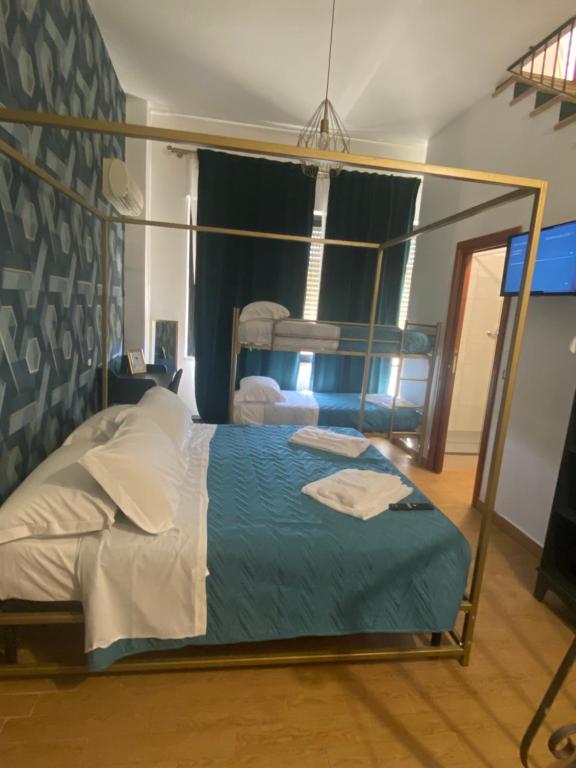 Łóżko lub łóżka w pokoju w obiekcie B&B Smeralda