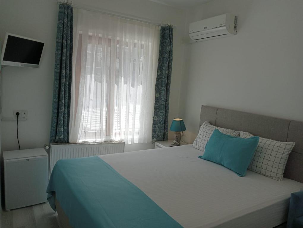 Postel nebo postele na pokoji v ubytování Daffne Otel