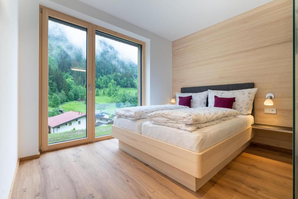 Postel nebo postele na pokoji v ubytování Apartment Fitsch