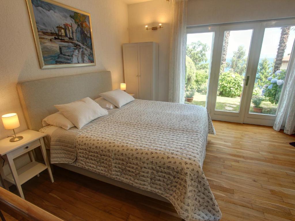 Łóżko lub łóżka w pokoju w obiekcie Premium Apartments Punta Kolova